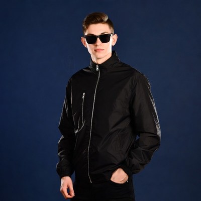 Young man in black jacket and sunglasses
