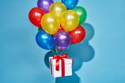 Colorful Balloons Lifting White Gift Box
