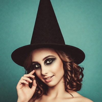 Woman in black witch hat