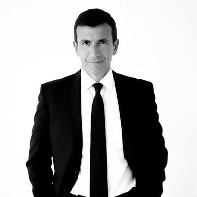 Man in black suit white shirt