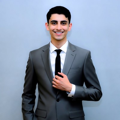 Smiling young man in gray suit