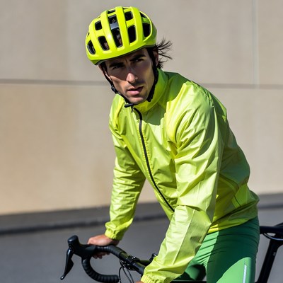 Man in yellow helmet on bike