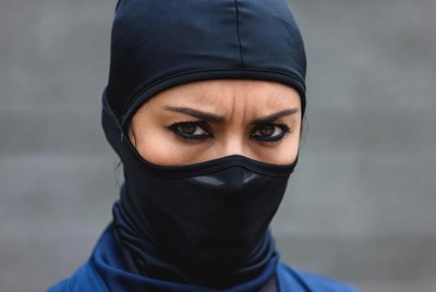 Woman in black balaclava mask