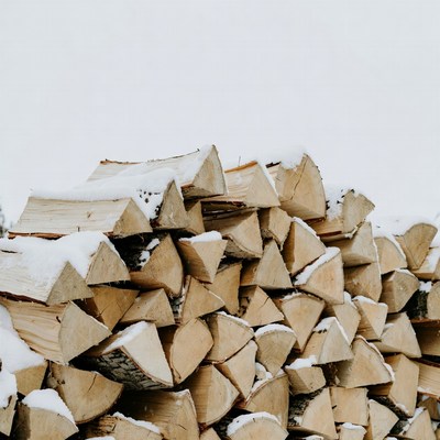 Snow-covered firewood stack