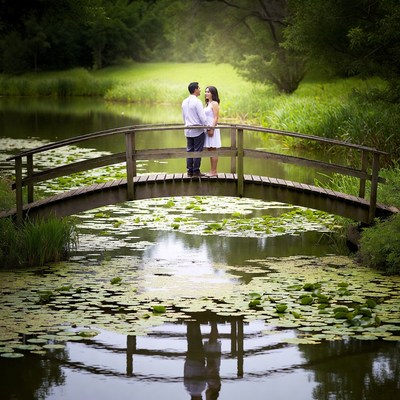Couple embracing on wooden bridge