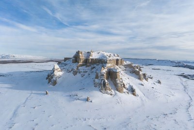 Snowy Cliffside Ruins Aerial View