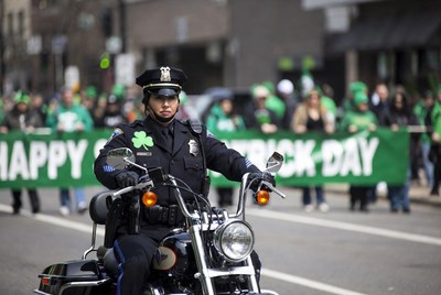 Policeman on motorcycle in St. Patrick's Day parade