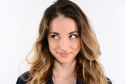 Woman smirking with playful side-eye