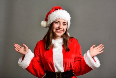 Smiling woman in Santa costume