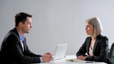 Man and woman in business meeting