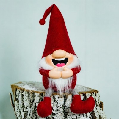 Smiling Red Gnome on Tree Stump