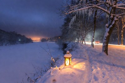 Snowy Lantern on Winter Riverside Path