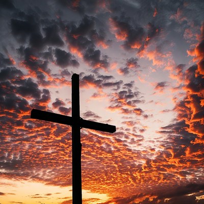 Silhouette Cross at Sunset Sky
