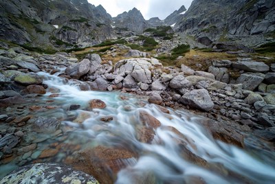 Mountain Stream Flowing Through Rocky Valley