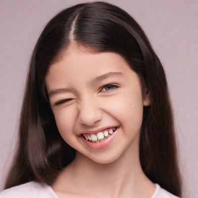 Girl winking with big smile