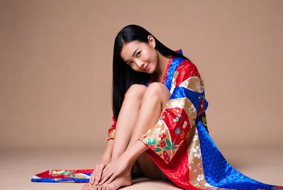 Asian woman in colorful kimono sitting