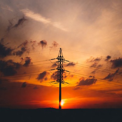 Electricity Pylon Silhouette at Sunset