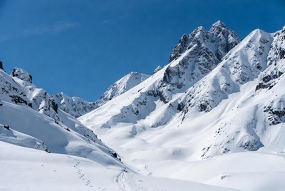 Snowy Mountain Peaks with Footprints