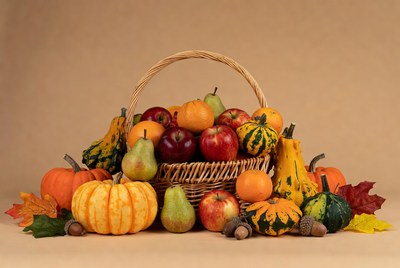 Wicker Basket of Autumn Fruits and Pumpkins