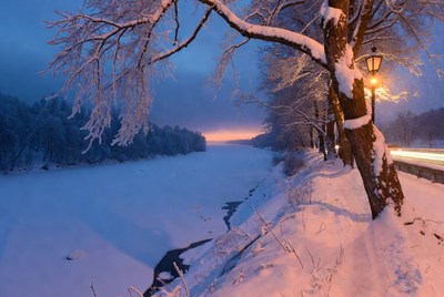 Snowy River with Lit Streetlamp