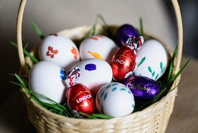 Colorful Easter eggs in wicker basket