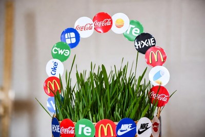 Brand logos arch on grass pot