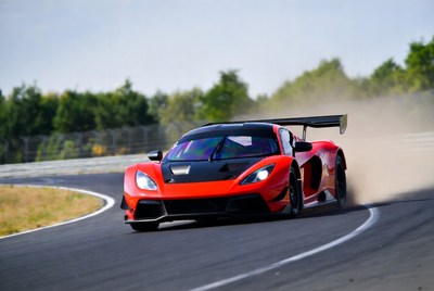 Red Race Car Drifting on Track