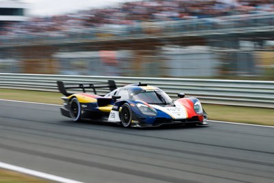 Racing Car Speeding on Track