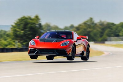 Red Supercar Jumping on Racetrack