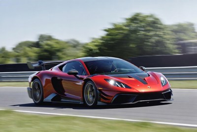 Red Lamborghini Huracan racing on track