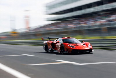 Red Supercar Racing on Track