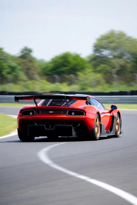 Red Supercar Cornering on Racetrack