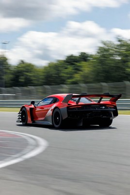 Red Race Car Speeding on Track