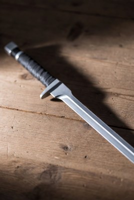 Tactical knife on wooden surface