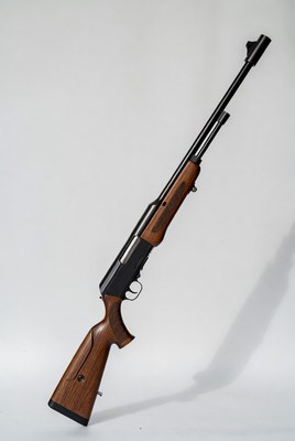 Bolt-action rifle with wooden stock