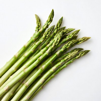 Fresh asparagus spears on white