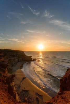 Sunset over beach cliffs