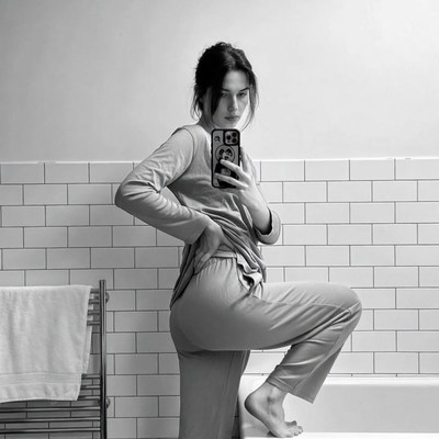 Woman taking selfie in bathroom