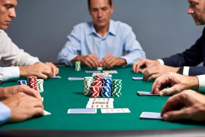 Men playing poker at table