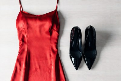 Red satin slip dress with black heels