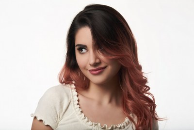 Woman with pink ombre hair smiling