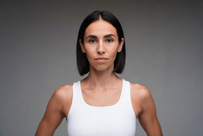 Woman in white tank top