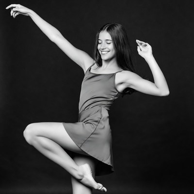 Young woman dancing ballet pose