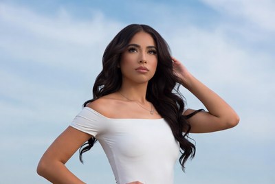 Latina woman in white off-shoulder dress