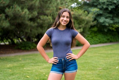 Smiling Latina girl in park