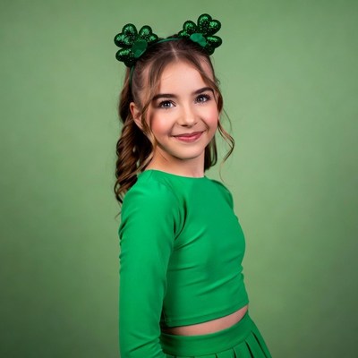Girl in green shamrock headband