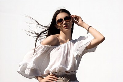 Woman in off-shoulder top with sunglasses