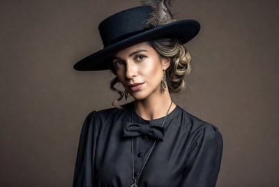 Woman in black hat and vintage dress