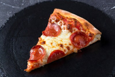 Pepperoni Pizza Slice on Black Slate