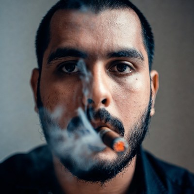 Man smoking cigar close-up